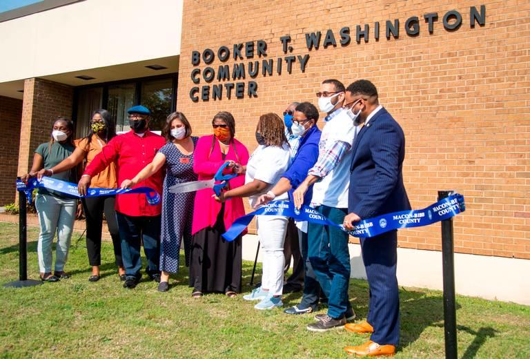  Community organization tenants of the newly renovated Booker T. Washington Community Center in the Pleasant Hill neighborhood cut a ribbon during a ceremony Wednesday afternoon. 