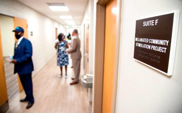 Visitors tour the newly renovated Booker T. Washington Community Center in the Pleasant Hill neighborhood Wednesday afternoon after a ribbon cutting ceremony. 