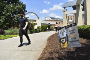 Kennesaw State University junior business management major Johnny Saale heads to class. Saale said he would get the COVID-19 vaccine if required. 