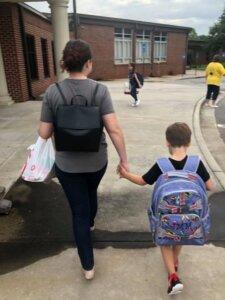 Child leaving school with his mother