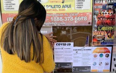 Signs posted in Latino businesses with information about COVID-19