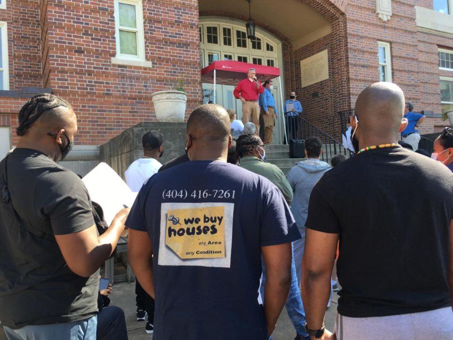 Macon-Bibb County Tax Commissioner Wade McCord briefs nearly 100 people who gathered at the courthouse steps for April’s auction of tax delinquent properties.