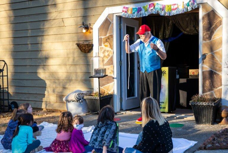 Business is slow for magician Stephen Spanks, and when he gets work, he often performs outdoors to crowds of children,some of whom are wearing masks. But Spanks said he is feeling optimistic about the year ahead.