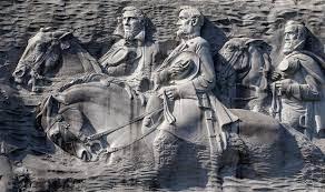 The giant carving at Stone Mountain has long faced outrage as a symbol glorifying the Confederacy, depicting Confederate President Jefferson Davis and Confederate generals Robert E. Lee and Thomas “Stonewall” Jackson.
