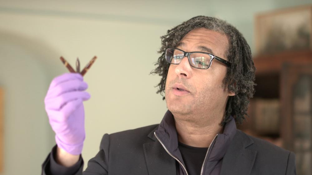 David Olusoga holding up Lancet.