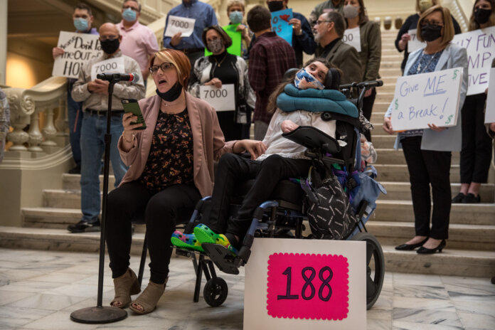 Callie Moore (right), who is 26 and lives in her own apartment in Athens, is one of 188 people in Georgia who may have to choose between state aid and the freedom to live where they want.