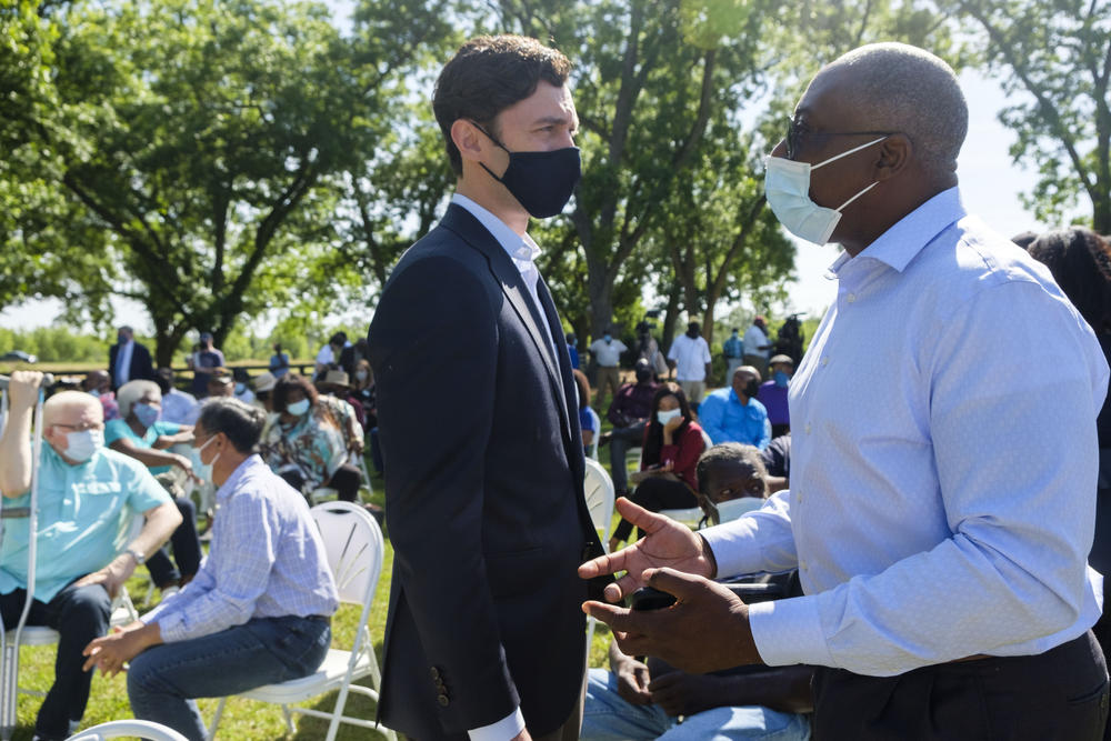 Poultry farmer Julian Marcus, right, explains to Senator Jon Ossoff how he is still in debt after making repairs on the farm caused by Hurricane Irma in 2017. The USDA debt relief will not be of direct aid to Marcus. 