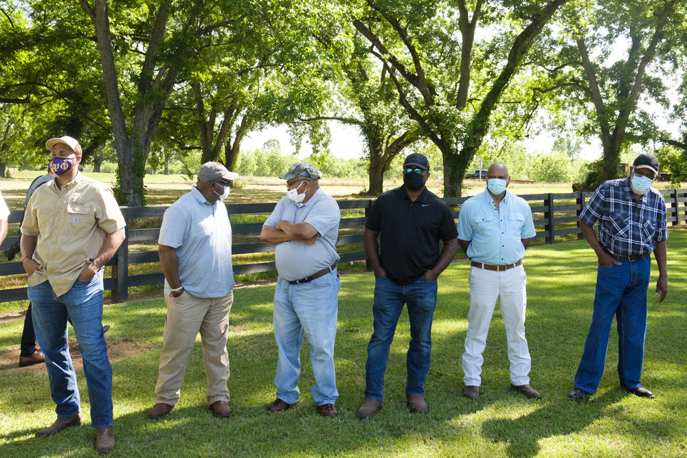 Farmers taking in the nuances of the $5 billion total aid package for "socially disadvantaged" farmers nestled in the American Rescue Plan at an informational event at Fort Valley State University. 