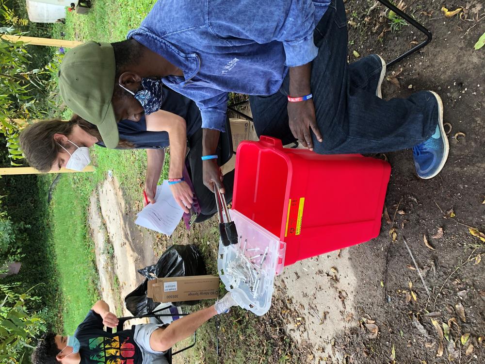 Volunteers with the Atlanta Harm Reduction Coalition at a syringe exchange in Atlanta.