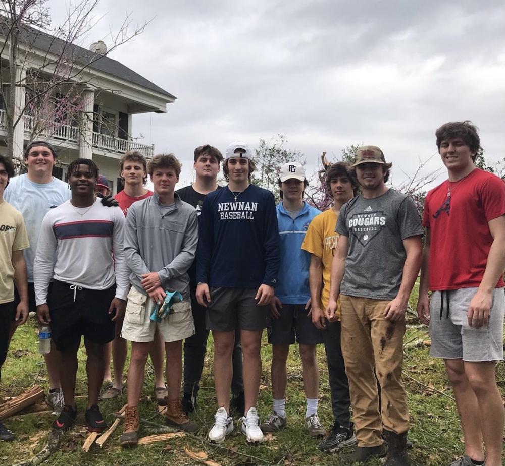 Newnan High School baseball team helps clean up storm damage 