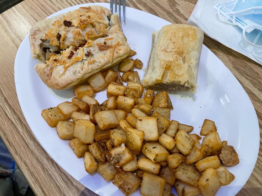 Steak, cheese and bacon pie and sausage roll from Australian Bakery Cafe