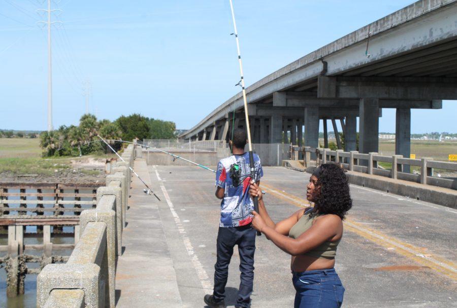 Jasmin Buggs and her boyfriend spend the day fishing off an old bridge over the Mackat River that once connected St. Simons Island and Brunswick.