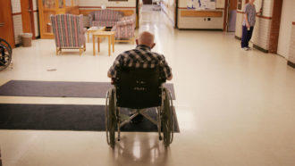 Elderly person in wheel chair