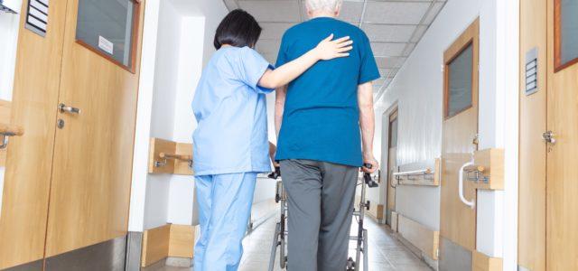 Nurse walking with elderly patient