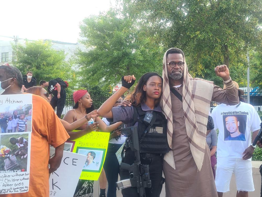 George Floyd's godparent, Stephen Jackson Jr., gestures with local activist Whitney Rose during a rally May 25, 2021.