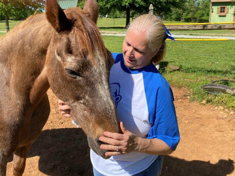 Ruth Wilson with one of her 17 horses