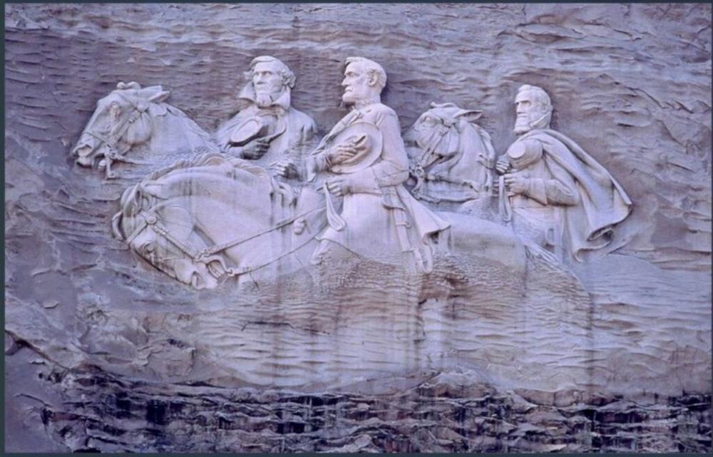 Left to right: Confederate President Jefferson Davis and Confederate Generals Robert E. Lee and Thomas “Stonewall” Jackson are carved into the side of Stone Mountain.