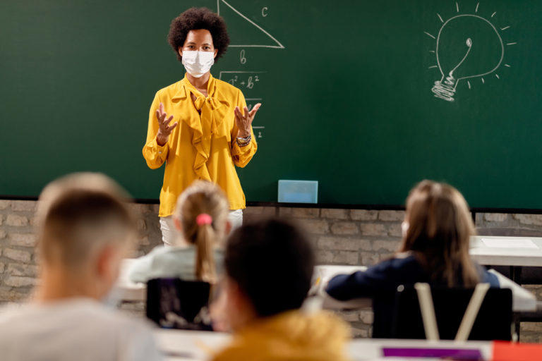 Teacher in classroom with students