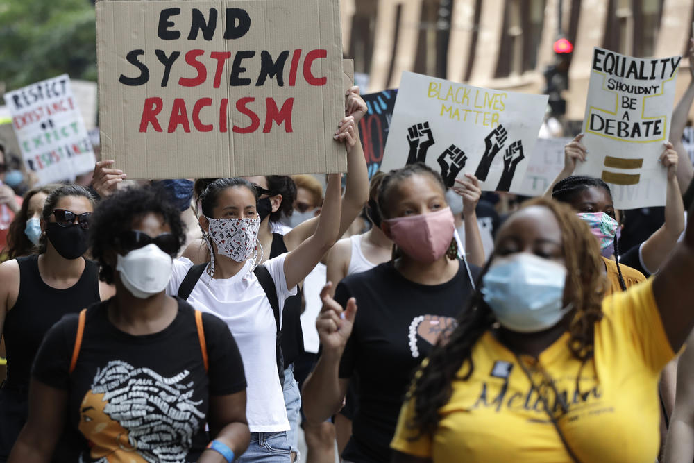 In this June 19, 2020, file photo, people demonstrate in Chicago, to mark Juneteenth.