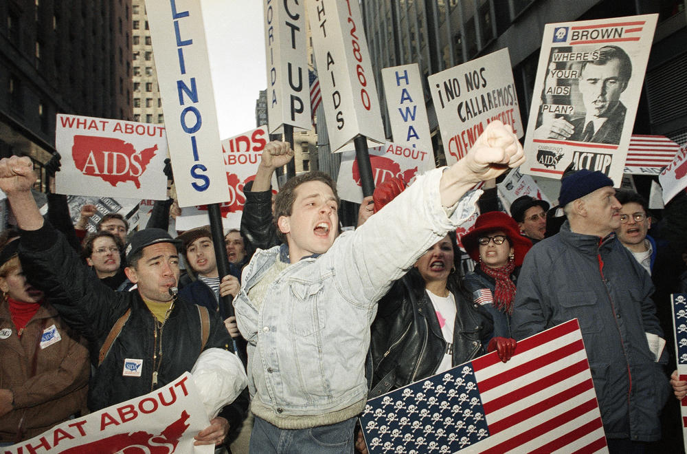 A man shouts from the crowd at an AIDs protest.
