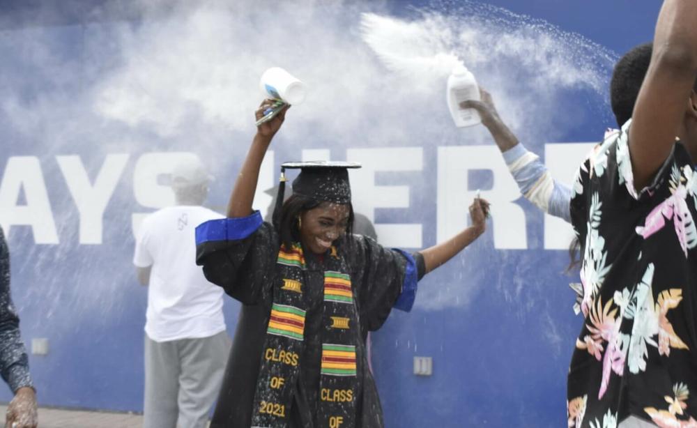 Grace Mbenza was surprised with baby powder confetti after graduating at Georgia State University's Center Parc Stadium in Atlanta in 2021. 