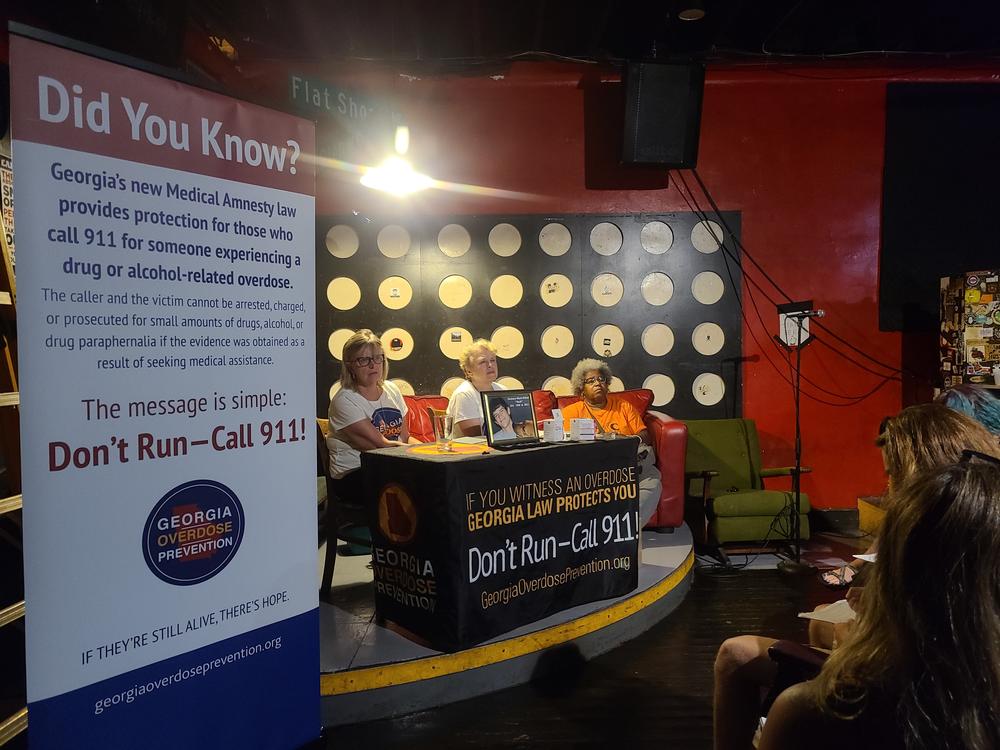 Georgia Overdose Prevention Co-Founders Robin Elliot, Laurie Fugitt, and Mona Bennett train a crowd to use Naloxone.