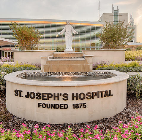 statue, fountain, and sign outside St. Joseph's Hospital in Savannah