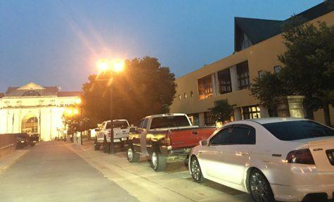 Vehicles were parked illegally on the sidewalk Thursday night on Cherry Street in Downtown Macon.