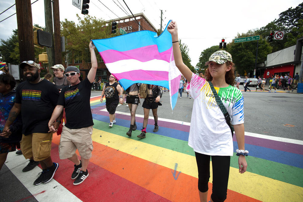 Supporters of Georgia's transgender and non-binary community stroll through the city's Midtown district during Gay Pride Festival's Transgender Rights March in Atlanta on Saturday, Oct. 12, 2019.