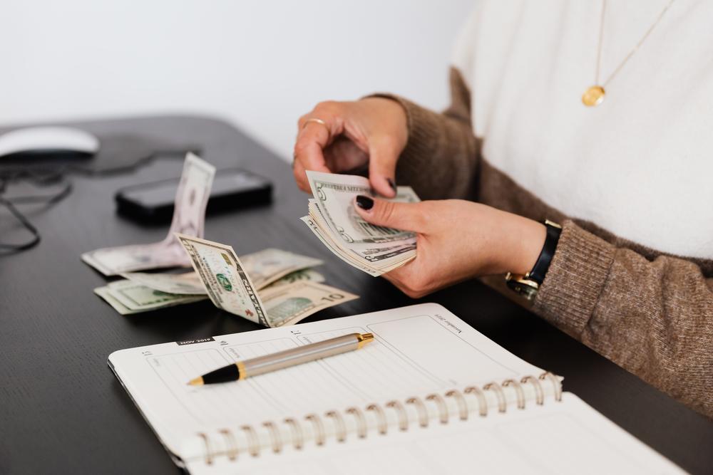 Woman Counting Out Money