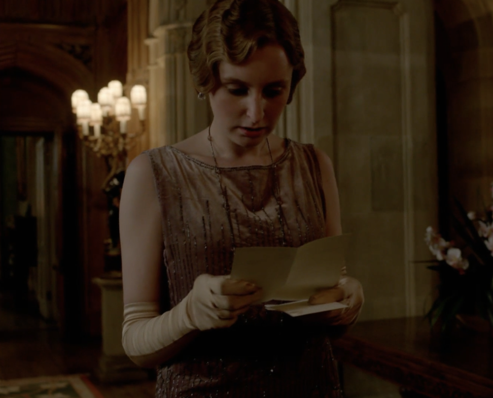 Edith reading a letter. 