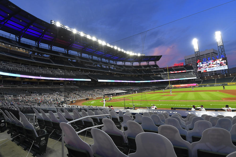 Cardboard cutouts of fans in the otherwise empty seats face the field during the sixth inning of a baseball game between the Atlanta Braves and Tampa Bay Rays in Atlanta, in this Thursday, July 30, 2020, file photo.