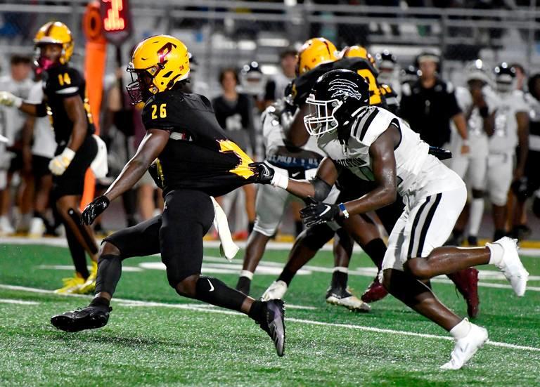 Perry running back Perell Lowe (26) breaks a tackle during the Panthers win over Houston County Friday night.