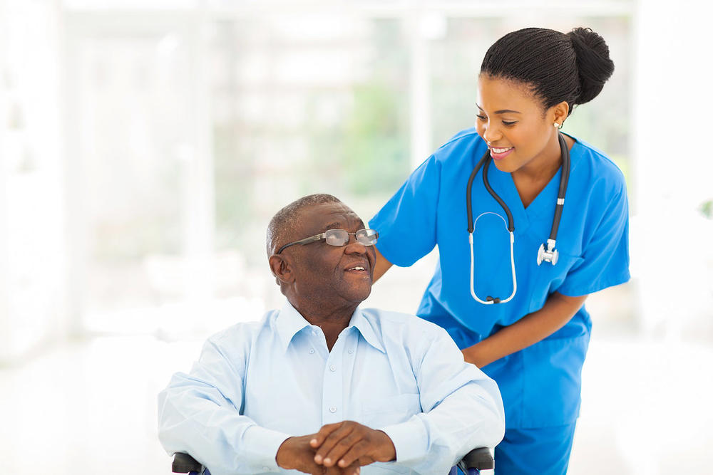 Nurse with patient in senior care