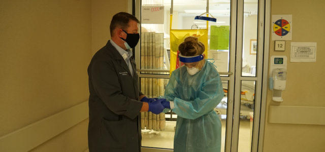 Rev. Will Runyon, Phoebe’s director of chaplaincy and palliative care prays with nurse Anna Grace Fulmer who works in the Phoebe Putney ICU.