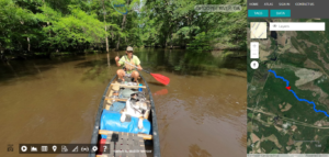  Joe Cook is seen paddling down Georgia’s Ohoopee River with his dog, Oconee, as he films the trip for an online river mapping project.