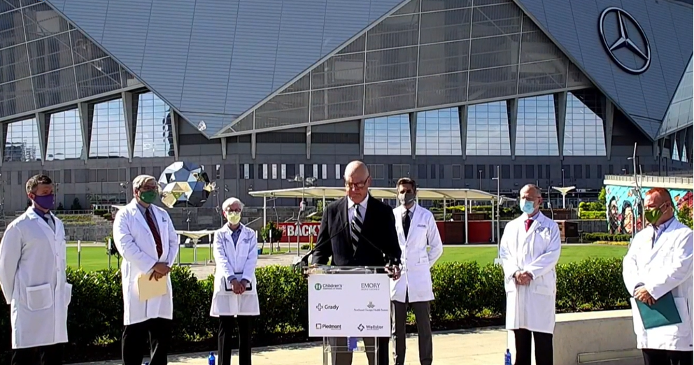 Doctors in metro Atlanta give a joint press conference outside Mercedes-Benz Stadium Aug. 19, 2021