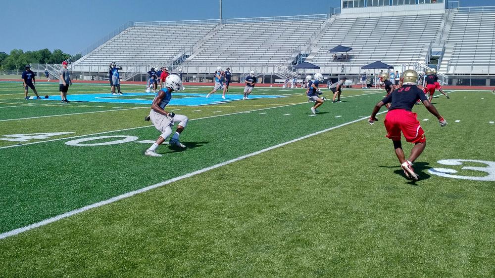 High school football team practices