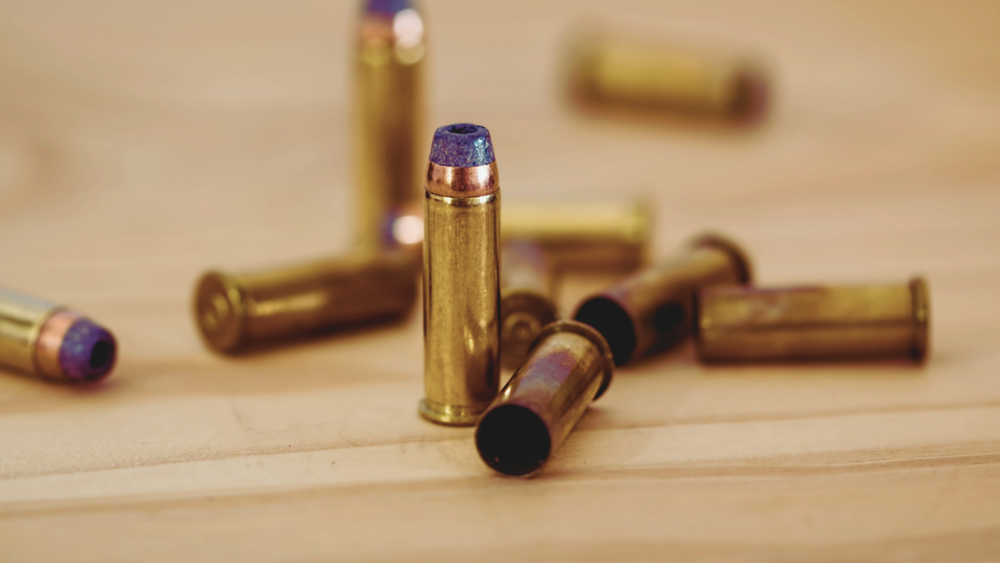 A group of bullets on a table.