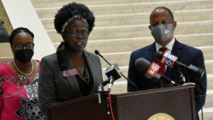 Rep. Jasmine Clark called on Gov. Brian Kemp to let universities make their own mask rules at a Capitol press conference Monday. 