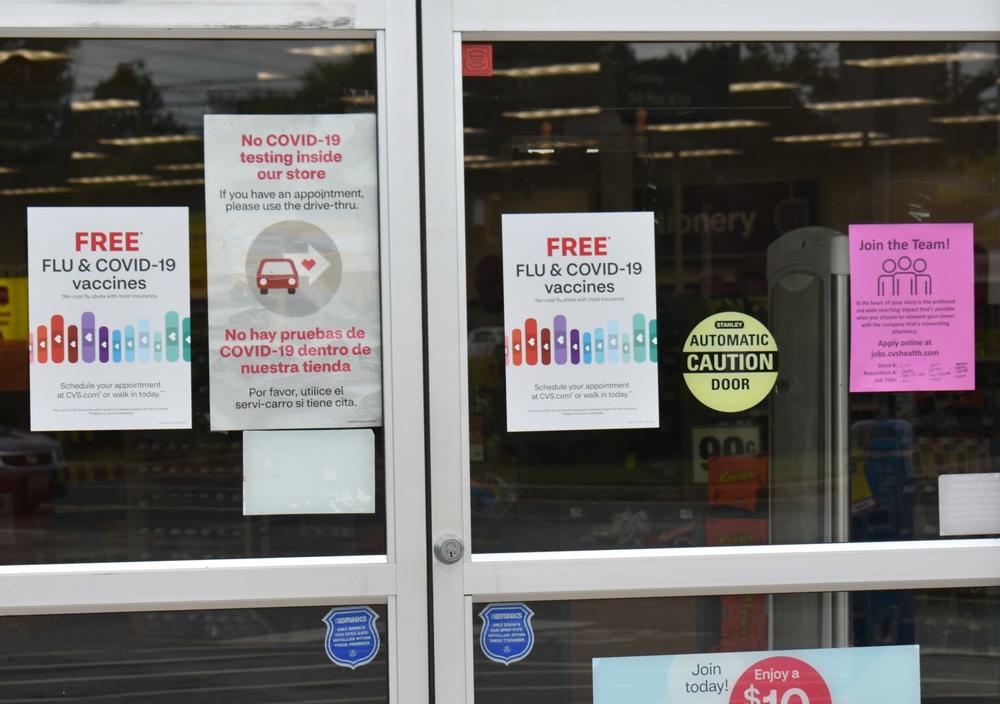  Signs outside a CVS Pharmacy in Cherokee County advertise free flu and COVID-19 vaccines. Health care experts hope flu shots along with masks and social distancing will help keep the coming flu season mild. 