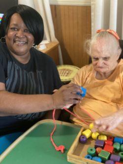 Ernestine Bryant works in a caregiver role as a “direct support professional” in Tifton, helping people who have intellectual and developmental disabilities.