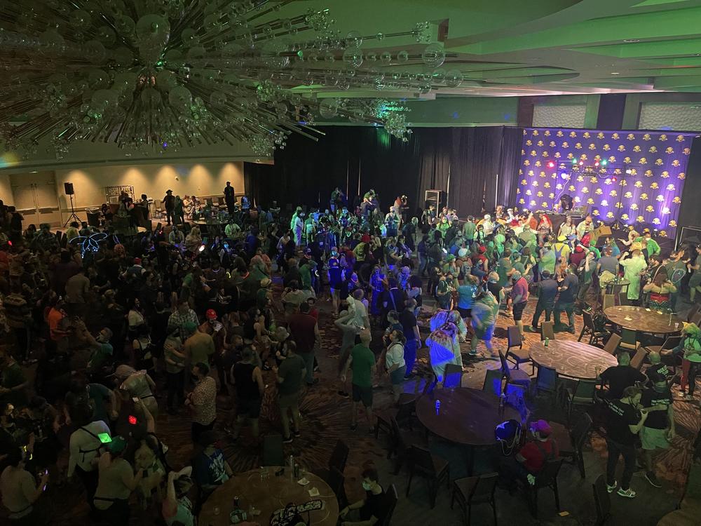 Dragon Con 2021 attendees dance at the "8-Bit Ball" on Thursday night.