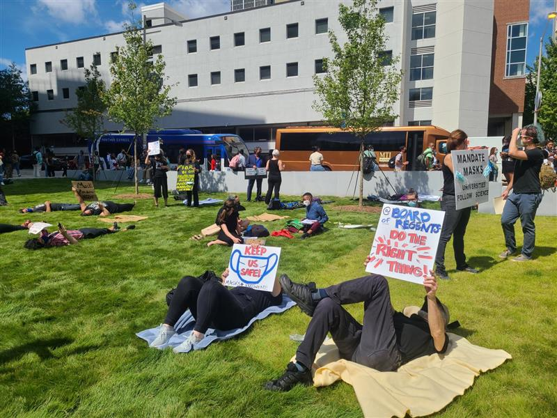 Staff and faculty at Georgia State University participate in a "die-in" protest Sept. 9, 2021, demanding more COVID-19 safety measures on campus.