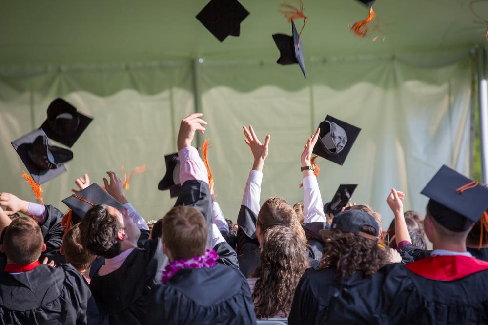 Graduates tossing hats