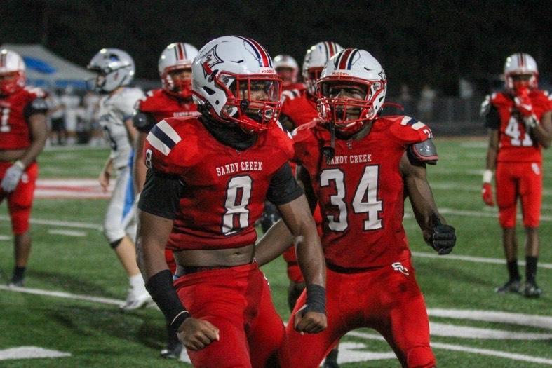 Marcellius Pulliam (8) and William Lyles (34) celebrate a big defensive play.