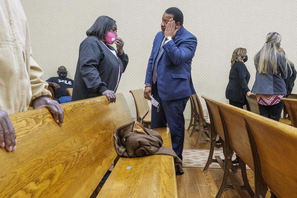 Attorney and civil rights activist Francys Johnson, right, talks with Helen Gilbert, the sister of Eurie Martin, during a break in the closing arguments in the murder trial of the three former Washington County Sheriff's Deputies in whose custody Martin died in 2017.