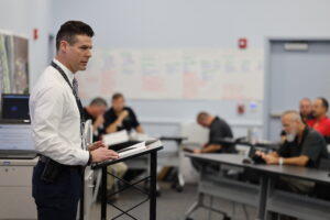 Capt. Jeremiah Bergquist of the Glynn County Police Department, serving as an incident commander, addresses public safety and first responders serving in the unified command put in place for the Ahmaud Arbery trial.