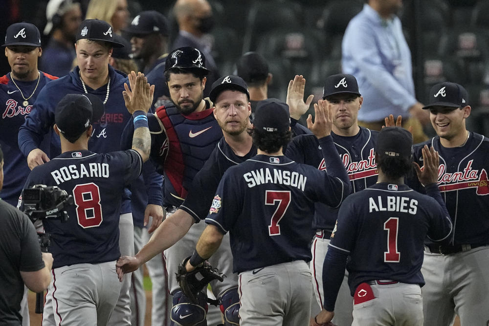 The Atlanta Braves celebrates after their win against the Houston Astros in Game 1 of baseball's World Series between the Houston Astros and the Atlanta Braves Tuesday, Oct. 26, 2021, in Houston. The Braves won 6-2.