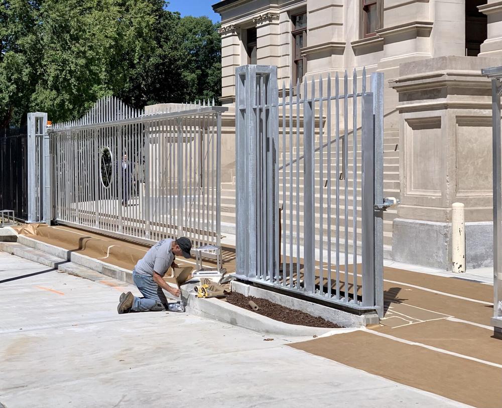 The Georgia Building Authority has been wrapping up the installation of the 8-foot tall security fence and gates surrounding the Georgia state Capitol. The fence project is on track to be completed by early October.